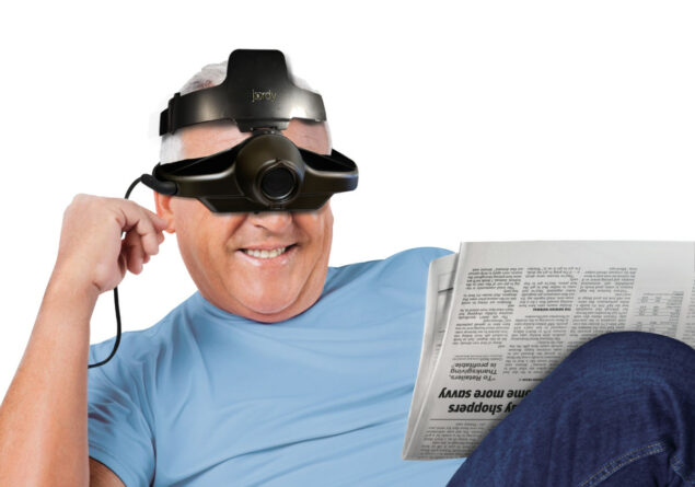 Jordy New Head Strap on a man reading a newspaper