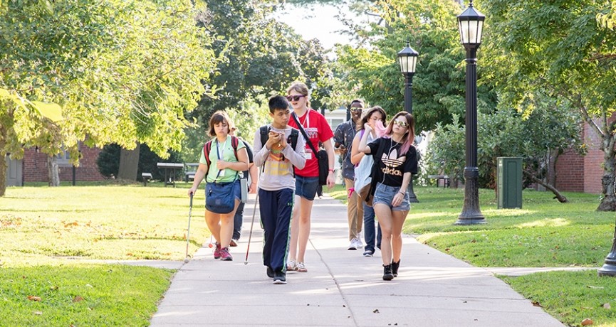 Image of young people walking on college campus
