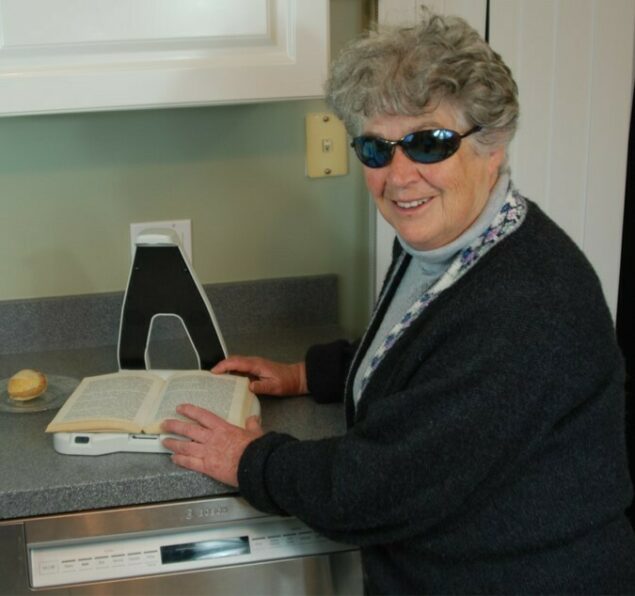 LyriQ Assistive Reader in the kitchen reading a recipe 1 2