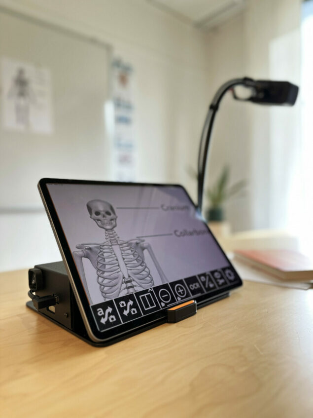 MagniLink WifiCam on desk showing skeleton on iPad