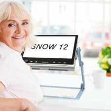 Snow 12 - Person sitting at table with Snow 12