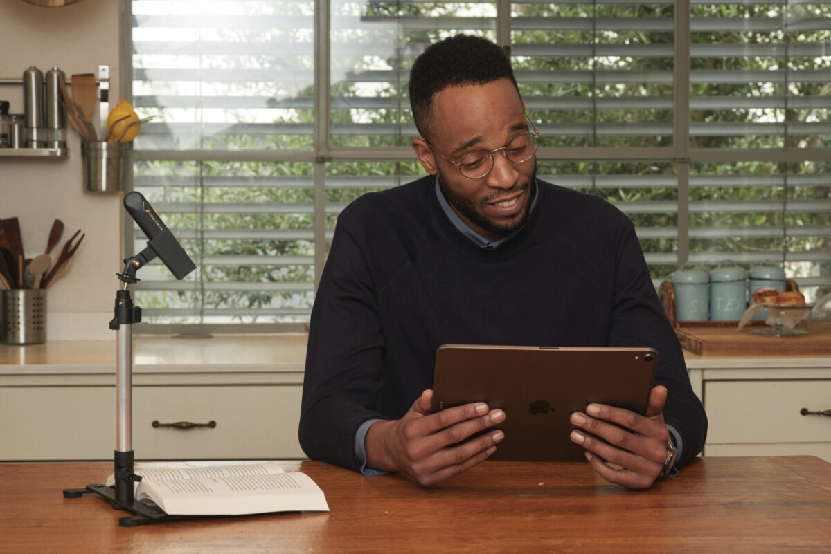 OrCam Read 3 person holding tablet