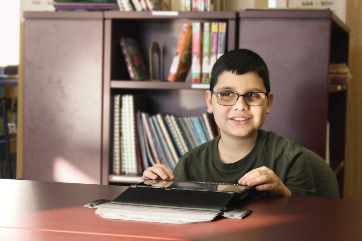 BrailleNote Touch Plus-Student with glasses using product