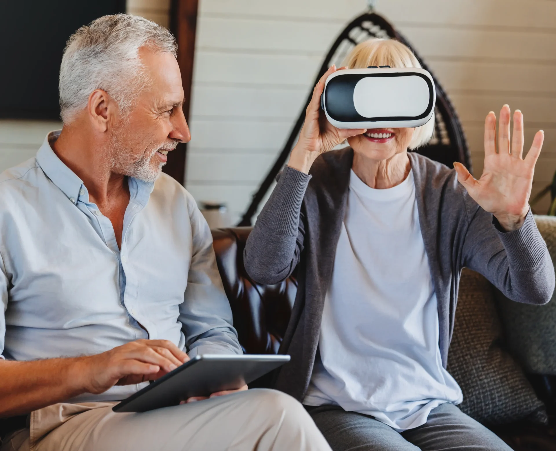 old-elderly-retired-woman-using-vr-virtual-reality-headset-apartment