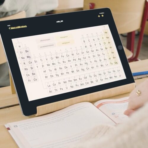 Image of My Board Buddy GO and a book on the desk